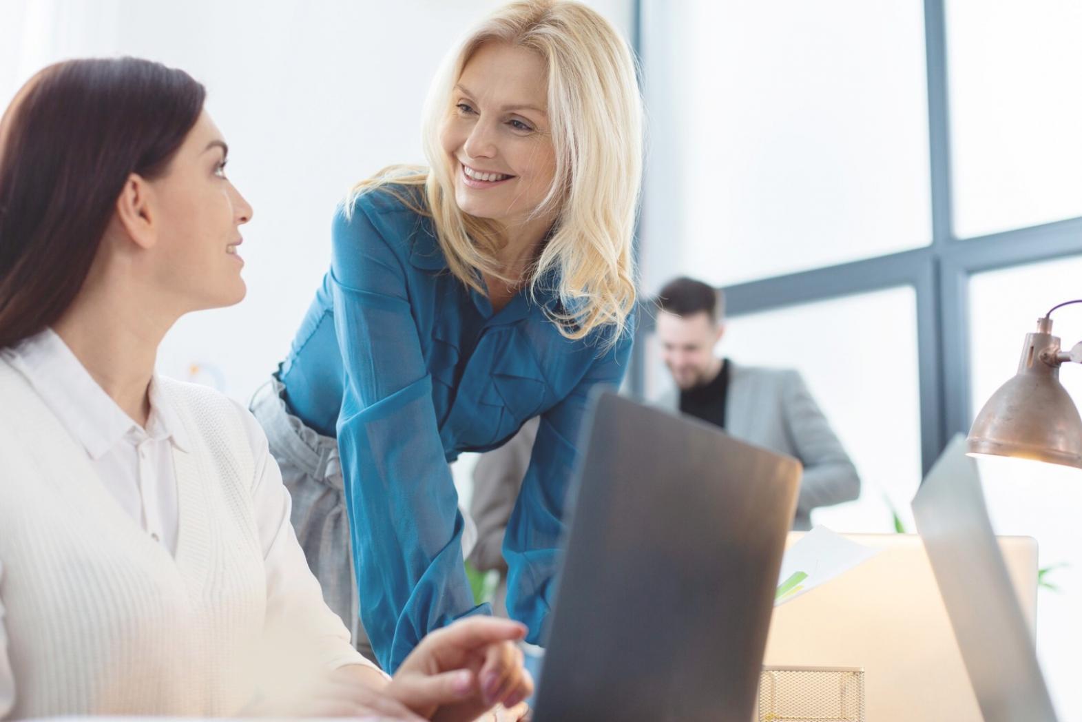 Investment education discussion session with students reviewing market analysis